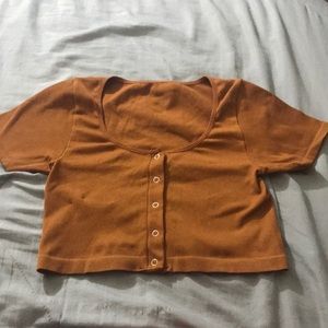 I am selling a orangy brownish colored shirt.